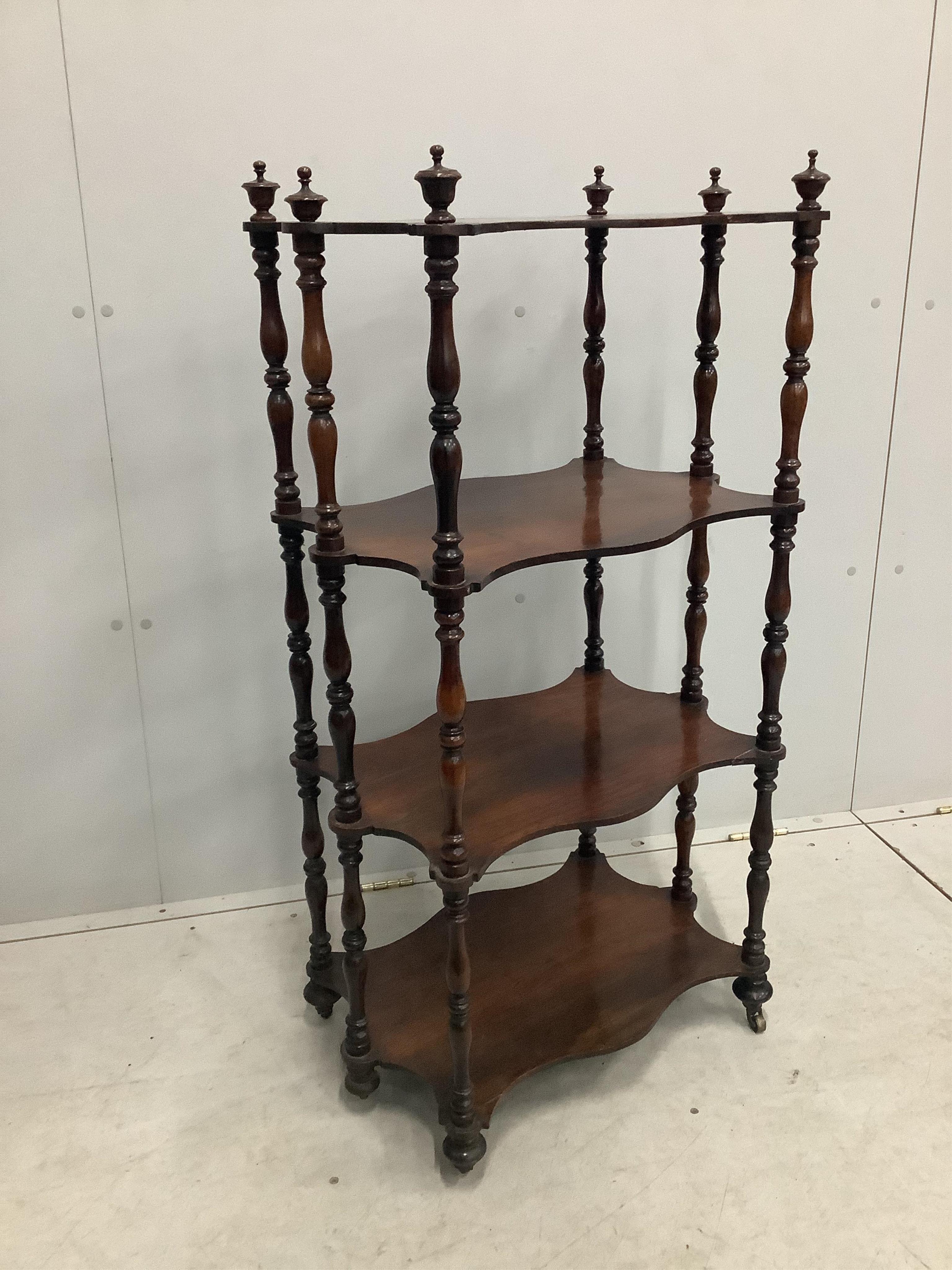 A Victorian four tier rosewood whatnot, width 57cm, depth 37cm, height 108cm. Condition - fair